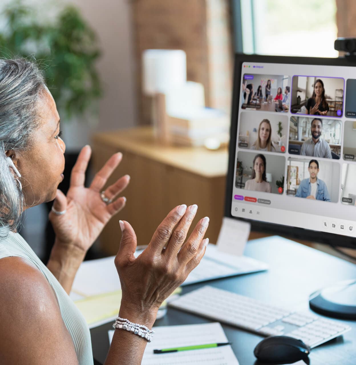 A woman attending a video conference meeting