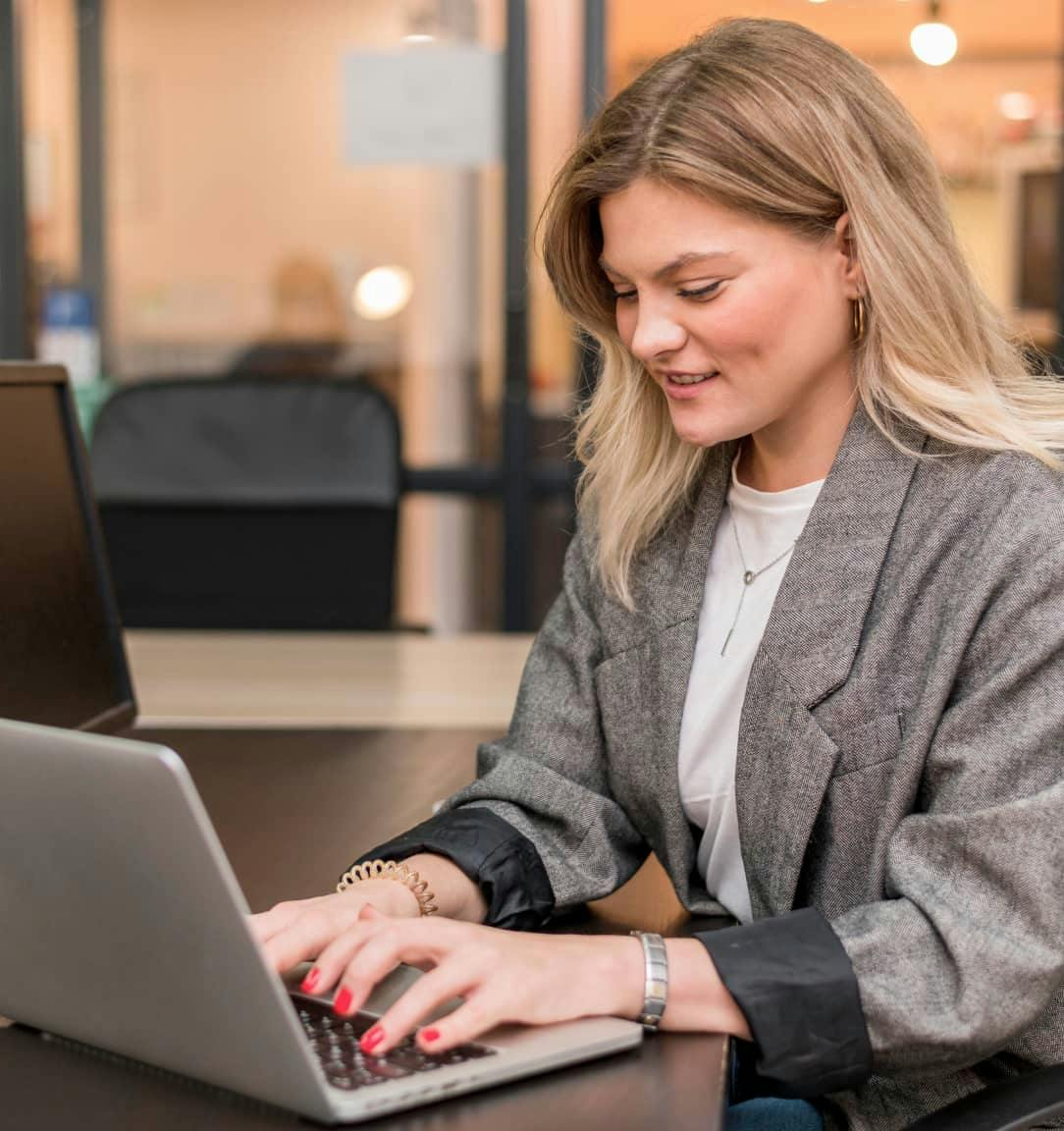 A lady working on a laptop