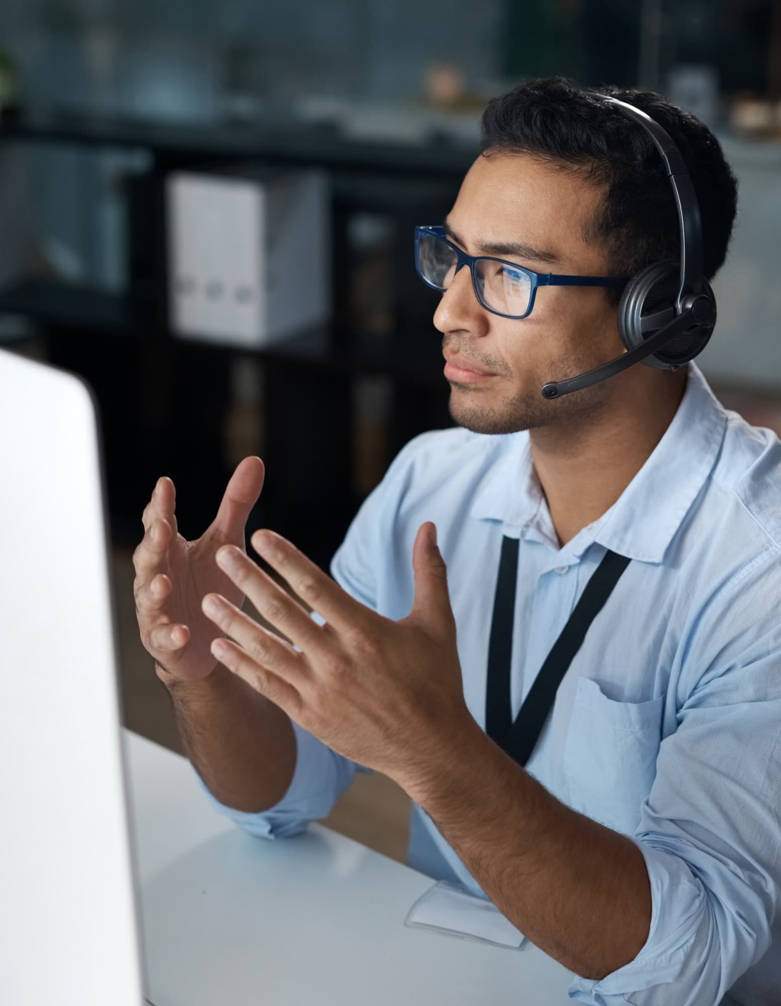 A car salesperson wearing a headset