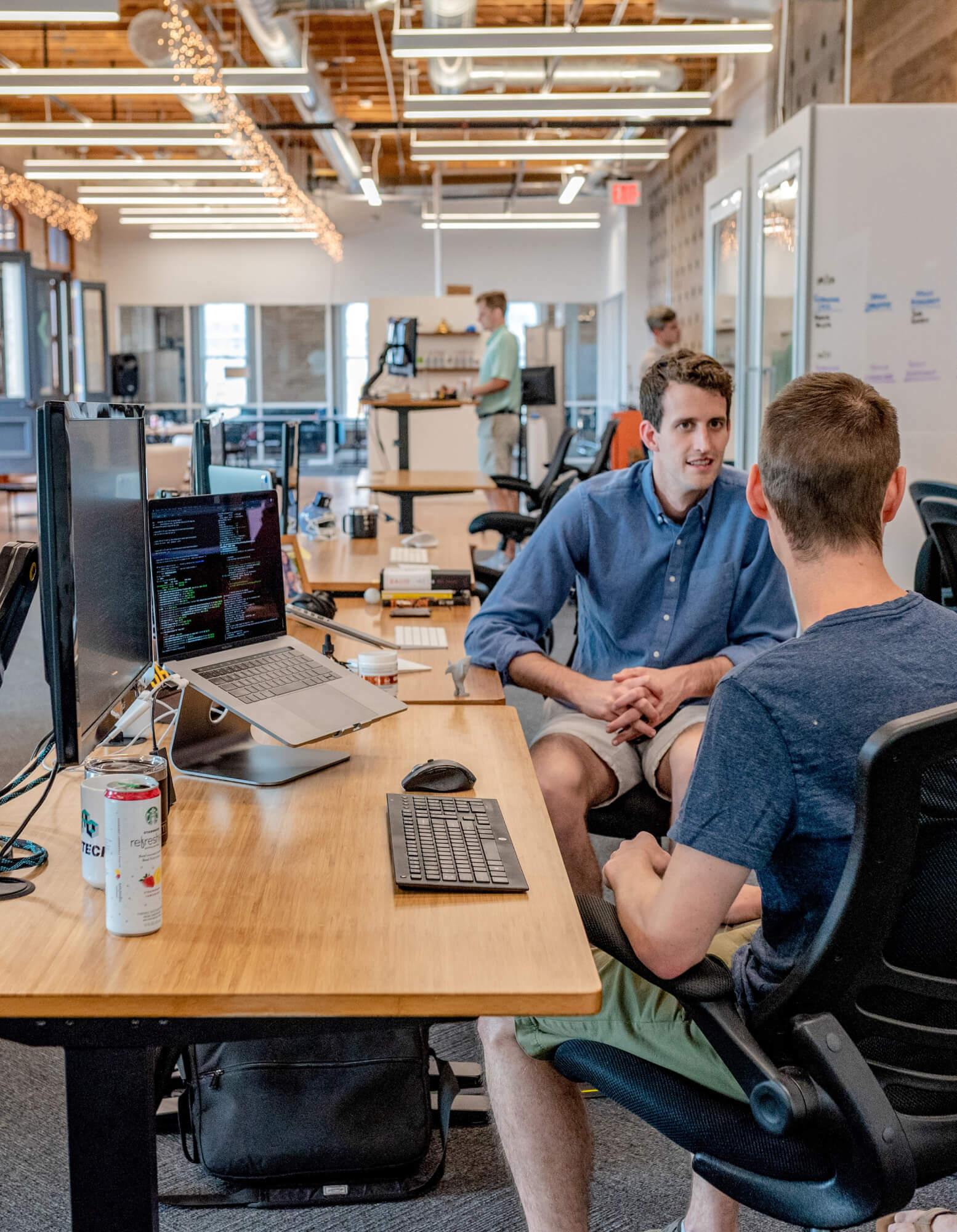 Photo of a group of employees working in an open-space office