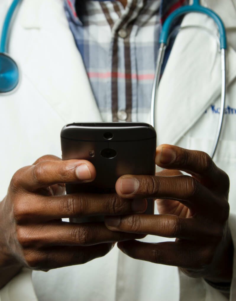 A doctor using his phone