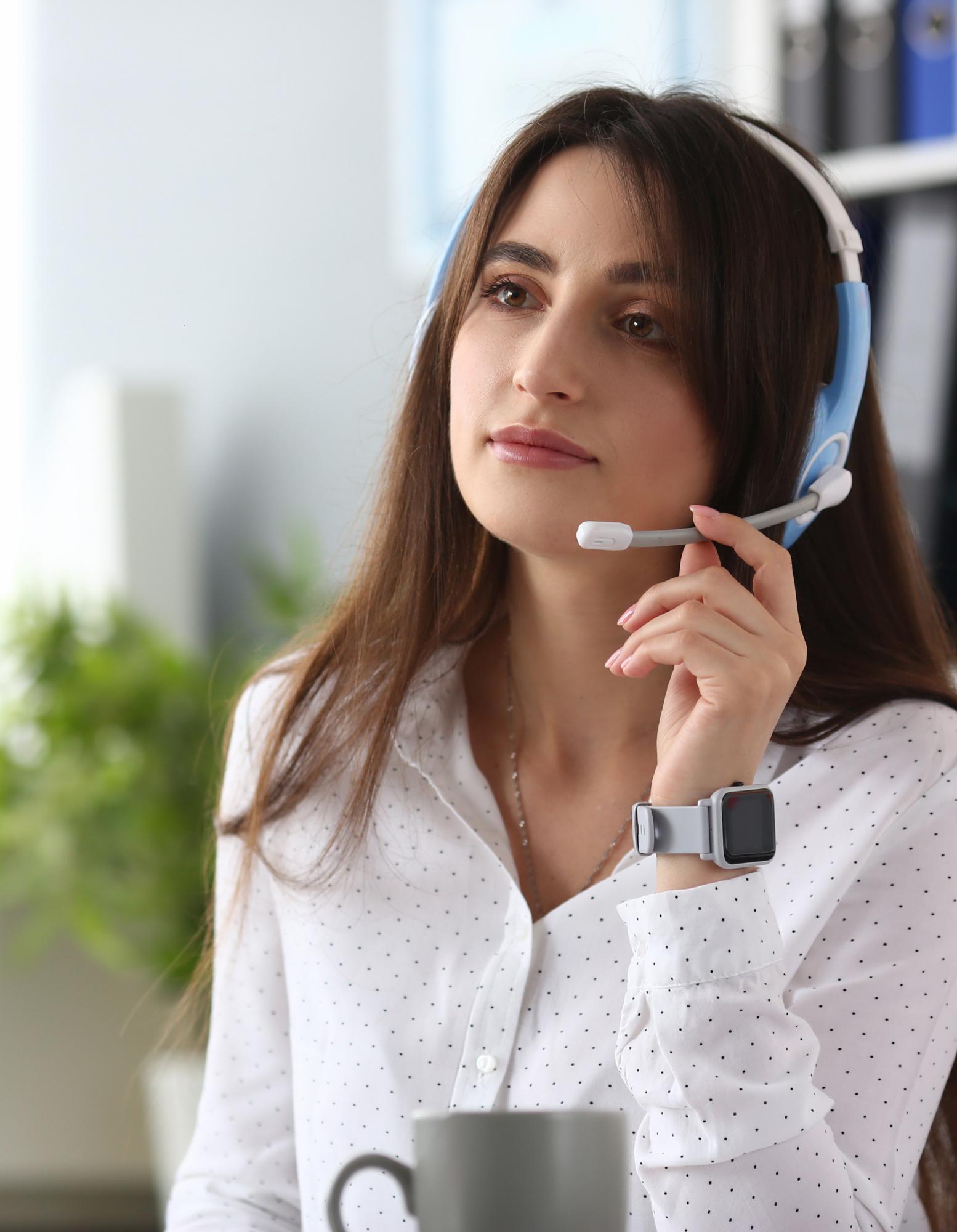 A contact center agent in the middle of a call, working from home