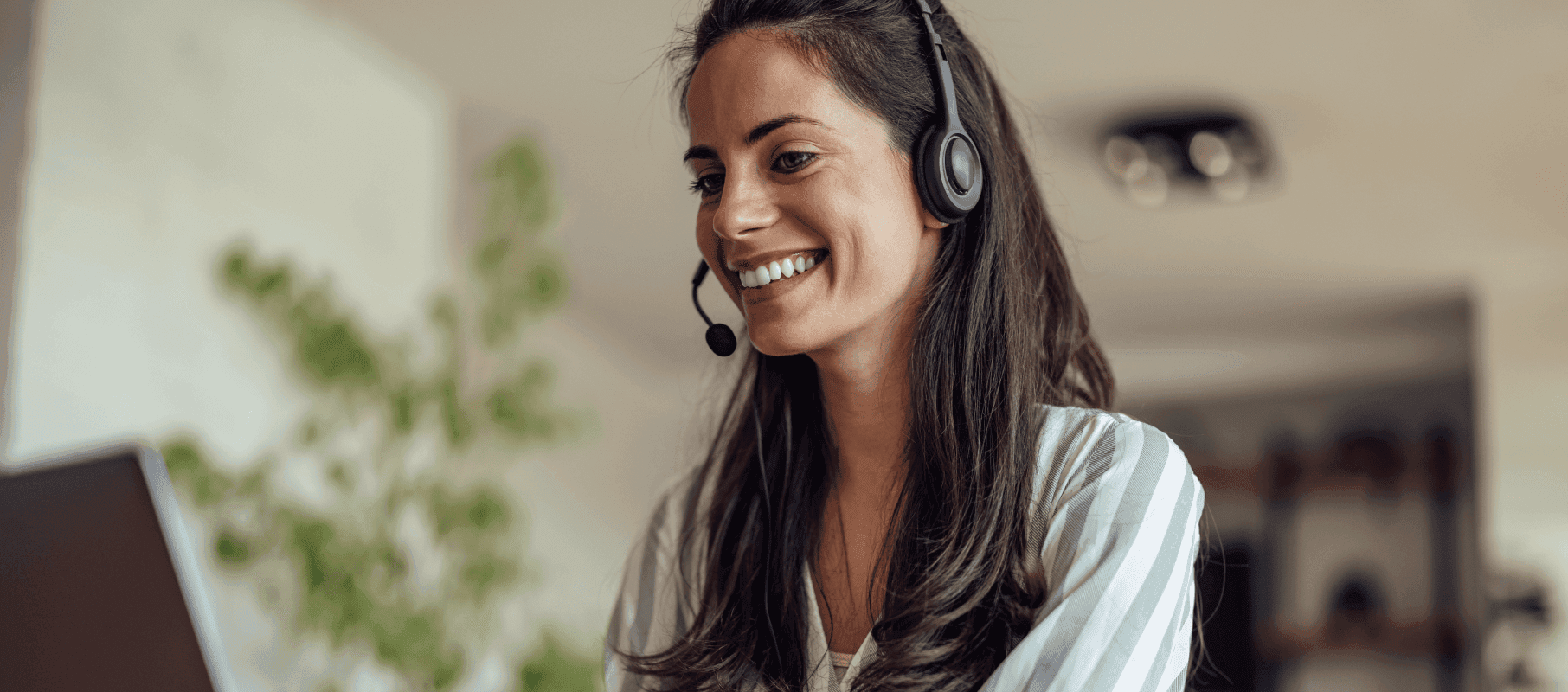 A smiling agent wearing a headset