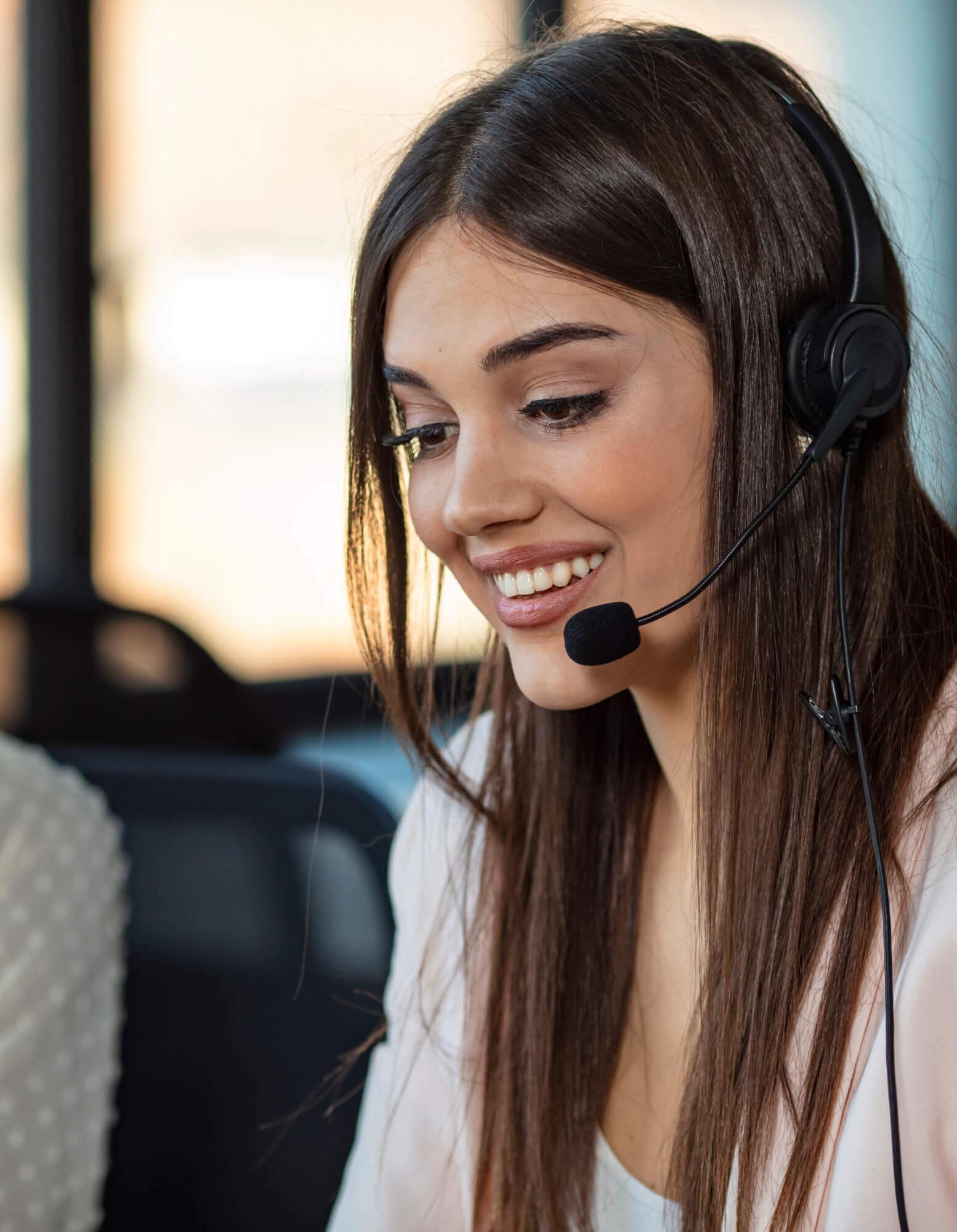 A contact centre agent wearing a headset while on a call