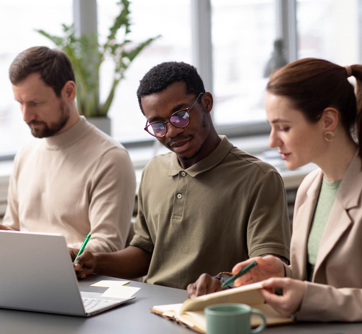 Three people working